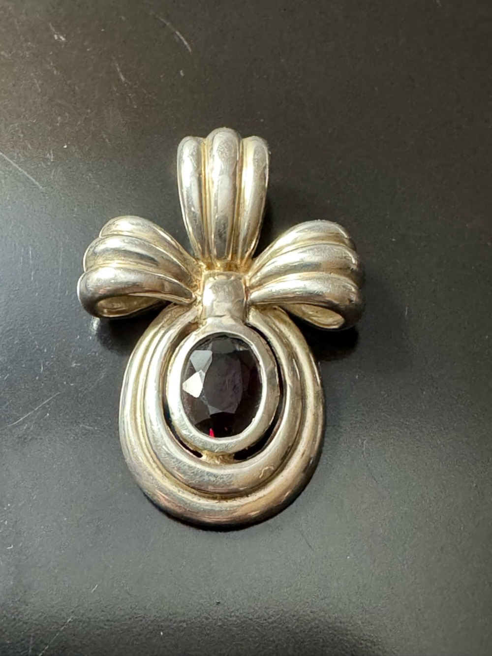 Sterling Silver Garnet Bow Pendant
